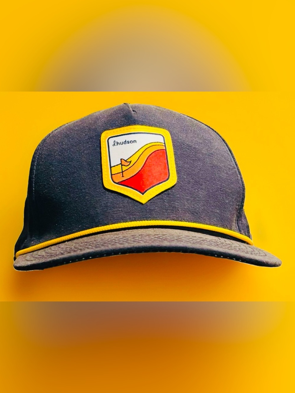 Hudson Jeans Navy Cap with Yellow Trim and Multicolor Crest
